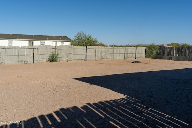view of yard with a fenced backyard