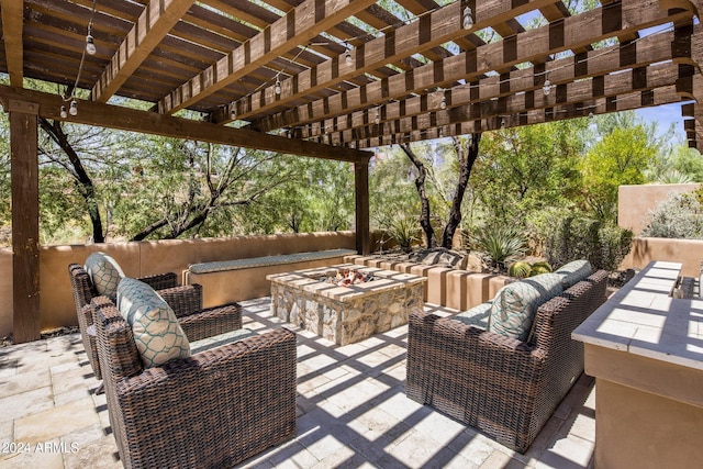 view of patio with a pergola and an outdoor living space with a fire pit