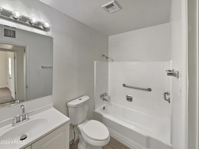 full bathroom with vanity, bathtub / shower combination, and toilet