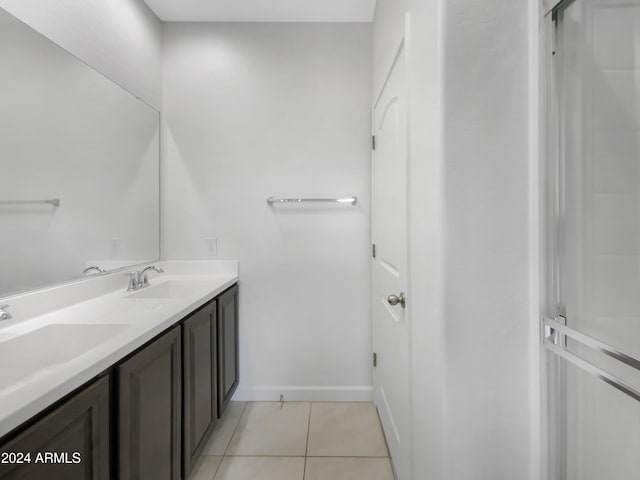 bathroom with tile patterned floors and vanity