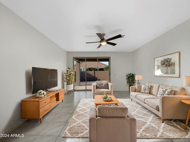 tiled living room featuring ceiling fan