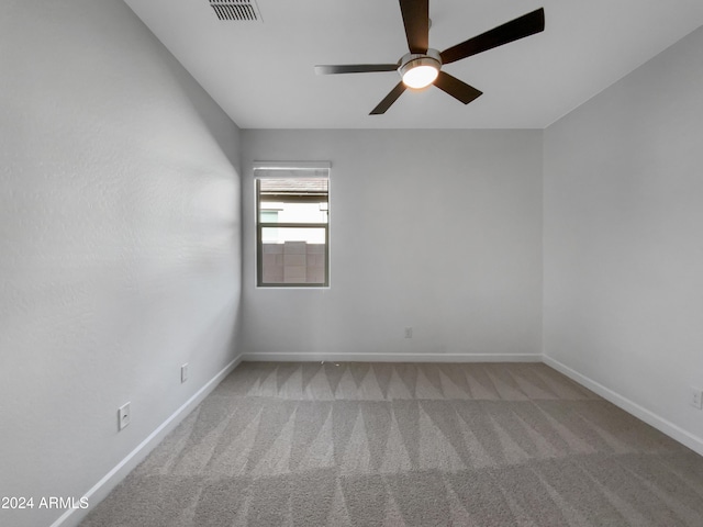 carpeted empty room with ceiling fan