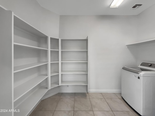 washroom featuring light tile patterned floors and washer / clothes dryer