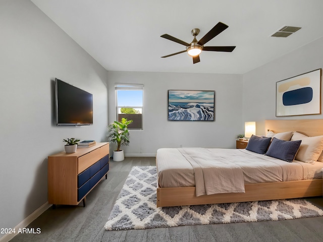 bedroom with hardwood / wood-style floors and ceiling fan