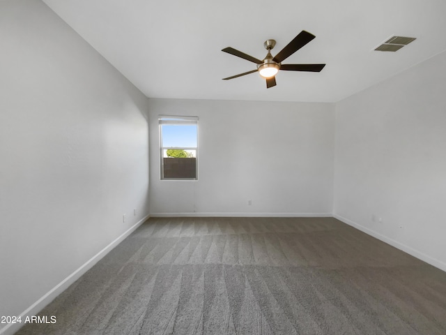 carpeted empty room featuring ceiling fan