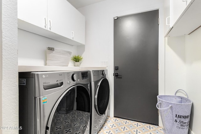 laundry area with cabinets and separate washer and dryer