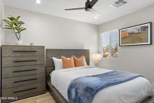 bedroom featuring light hardwood / wood-style floors and ceiling fan