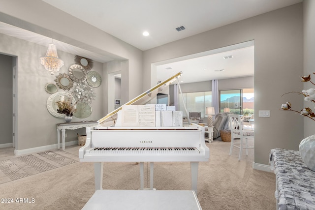 misc room with light colored carpet and an inviting chandelier