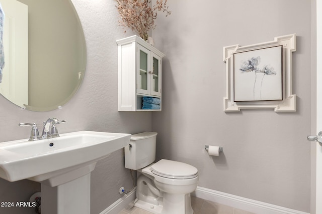 bathroom featuring tile patterned floors, sink, and toilet