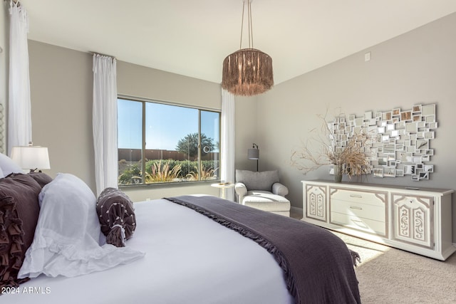 bedroom featuring light carpet