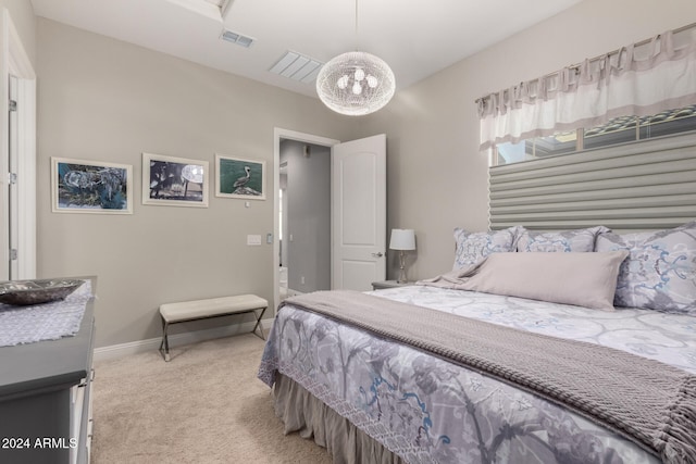 bedroom featuring light colored carpet