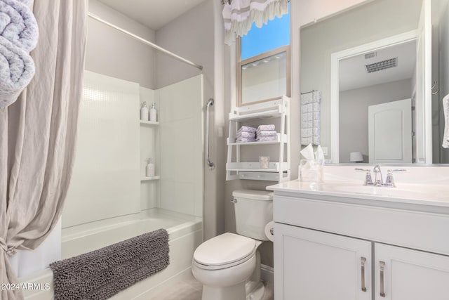 full bathroom featuring vanity, toilet, and shower / tub combination