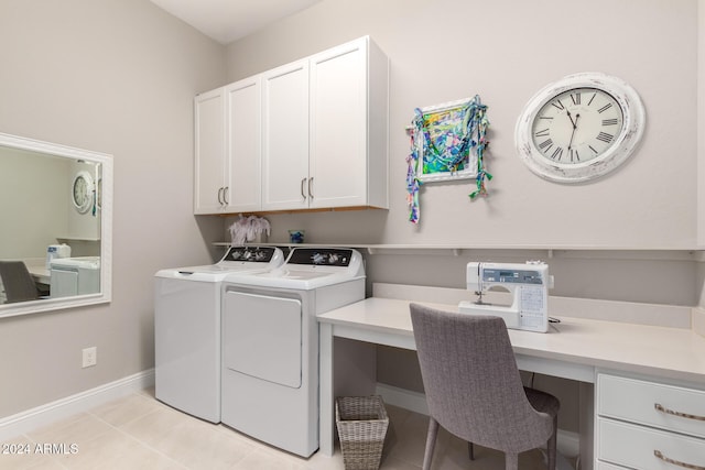 washroom featuring cabinets, light tile patterned floors, and separate washer and dryer