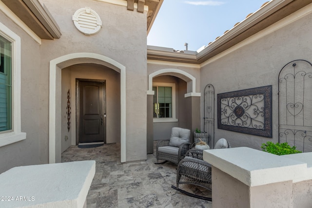 doorway to property with a patio area