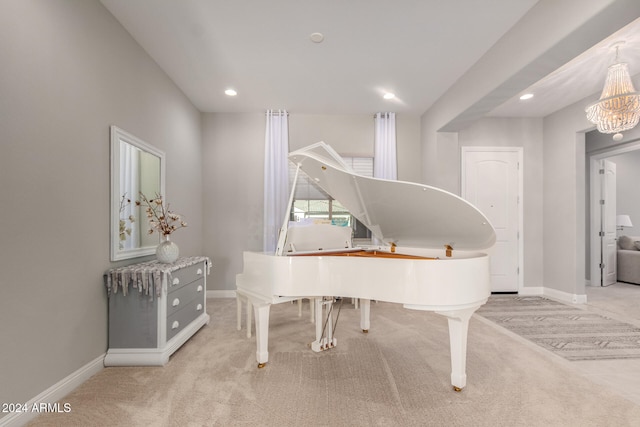 miscellaneous room with a chandelier and light colored carpet