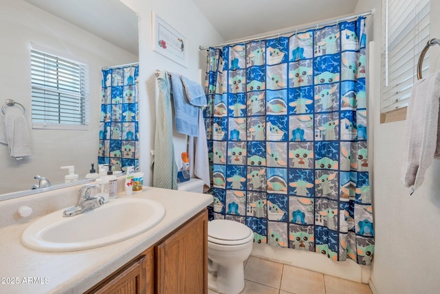 bathroom with shower / tub combo with curtain, vanity, toilet, and tile patterned floors