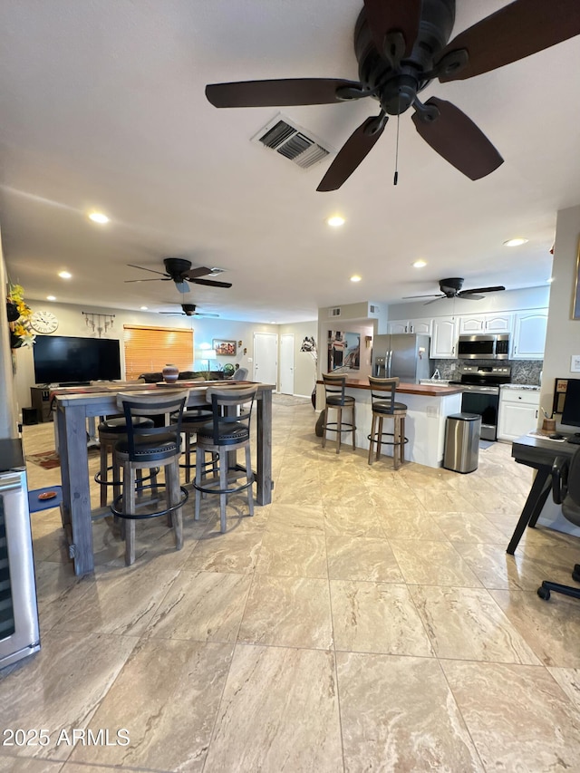 dining area with visible vents and recessed lighting