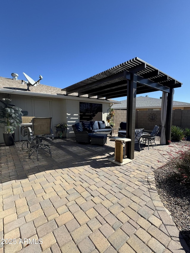 view of patio / terrace with fence, an outdoor hangout area, and a pergola