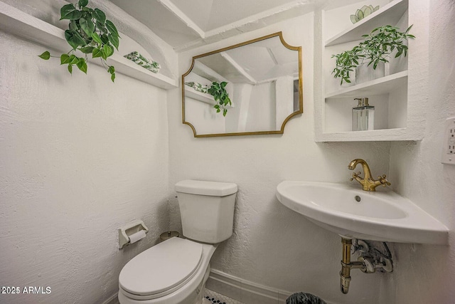 bathroom featuring toilet