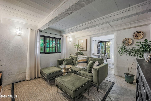 living room with beam ceiling and wooden ceiling