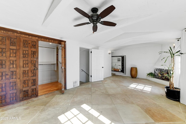 unfurnished bedroom with lofted ceiling