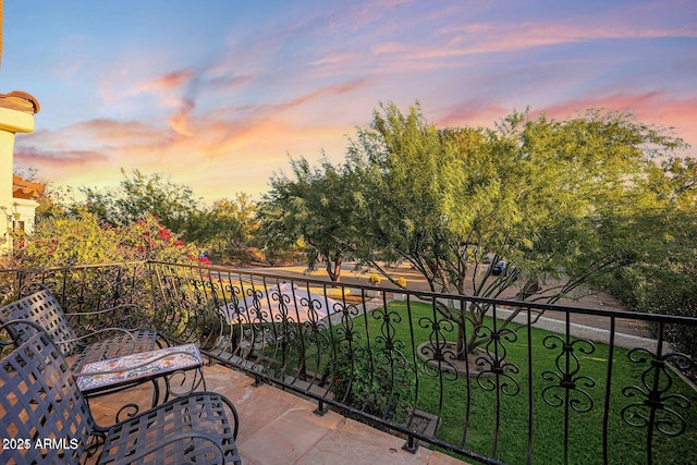 view of balcony at dusk