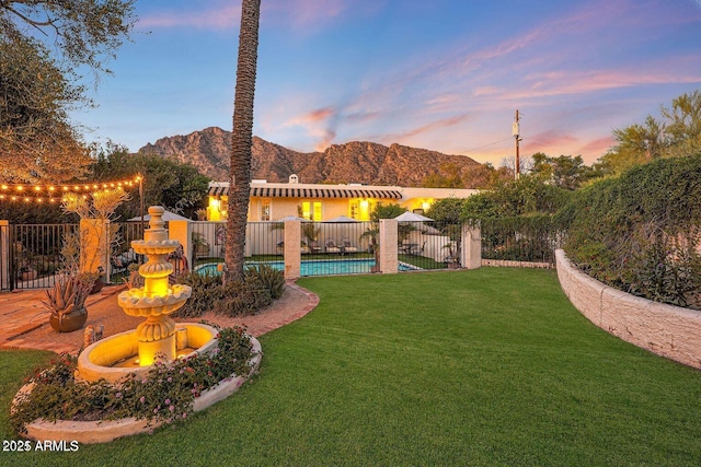 yard at dusk with a mountain view