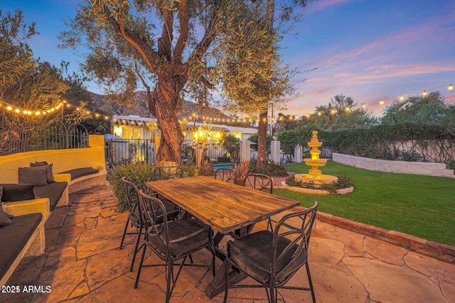 view of patio terrace at dusk