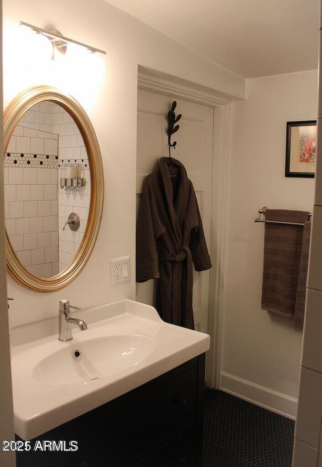 bathroom featuring tile patterned flooring and vanity