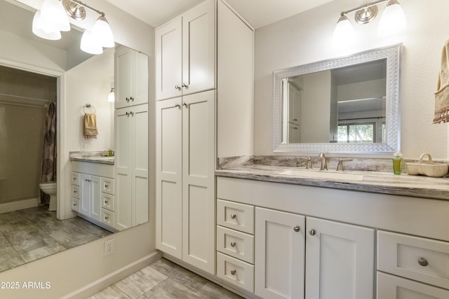 bathroom with vanity and toilet