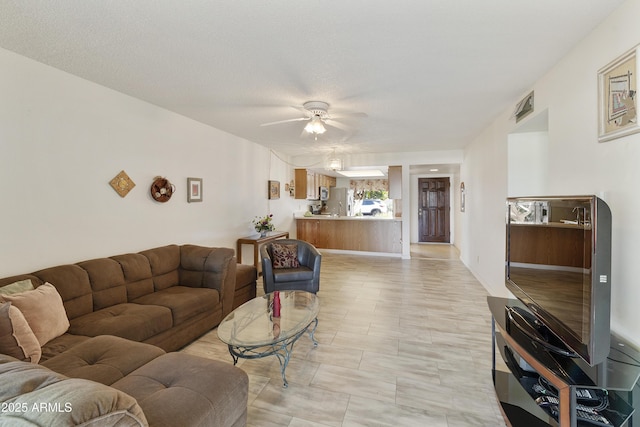 living room featuring ceiling fan