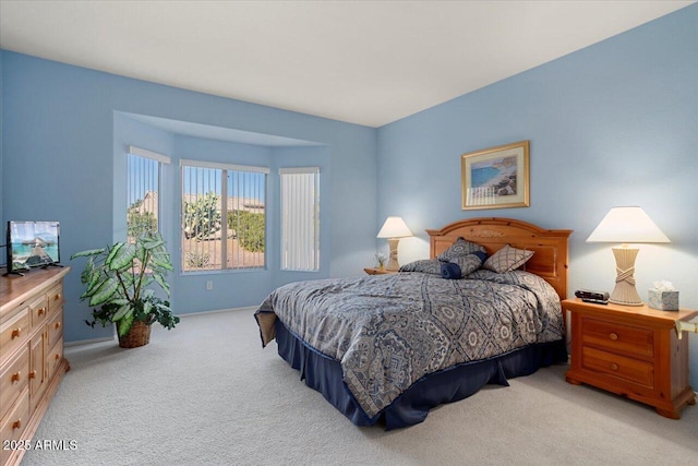 bedroom with light colored carpet