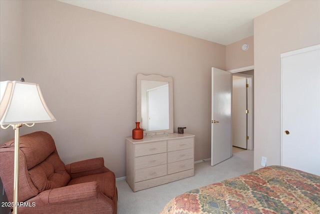 bedroom with light colored carpet