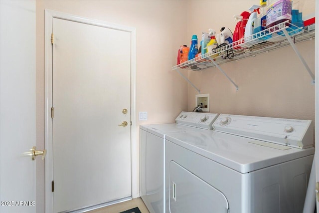 clothes washing area featuring independent washer and dryer