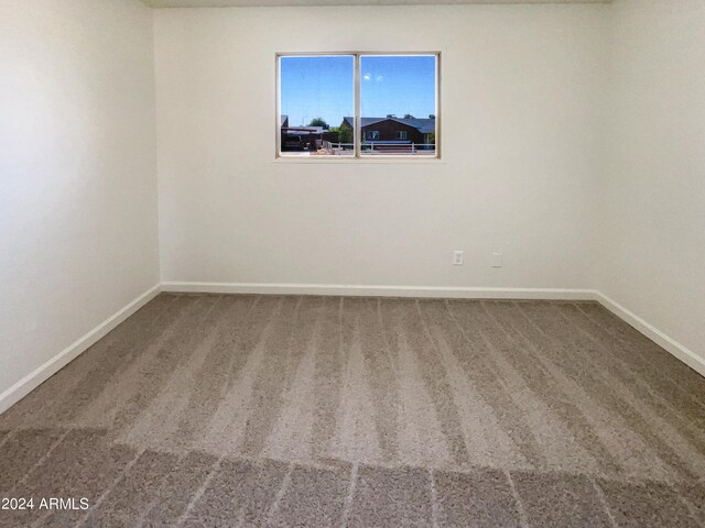 empty room featuring carpet flooring