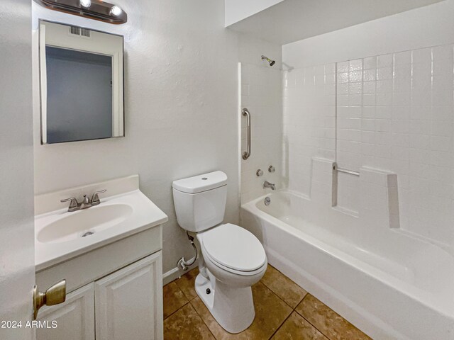 full bathroom with shower / tub combination, tile patterned flooring, toilet, and vanity