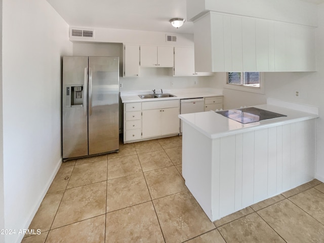 kitchen featuring stainless steel refrigerator with ice dispenser, white dishwasher, kitchen peninsula, sink, and white cabinets