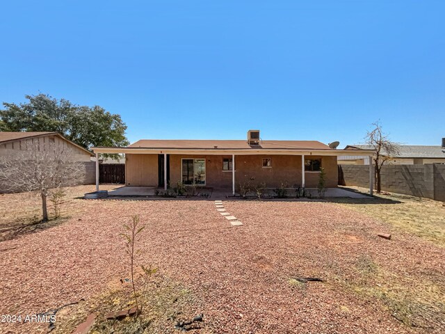 rear view of property with a patio area