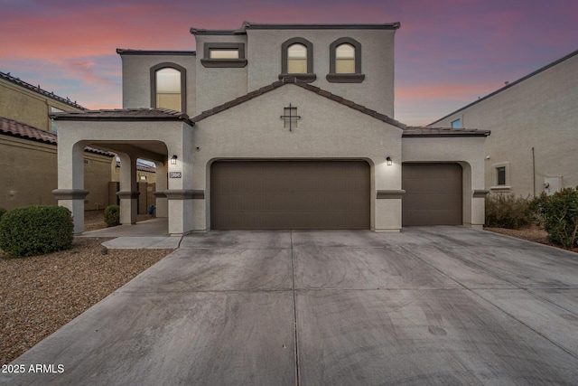 mediterranean / spanish-style house featuring a garage