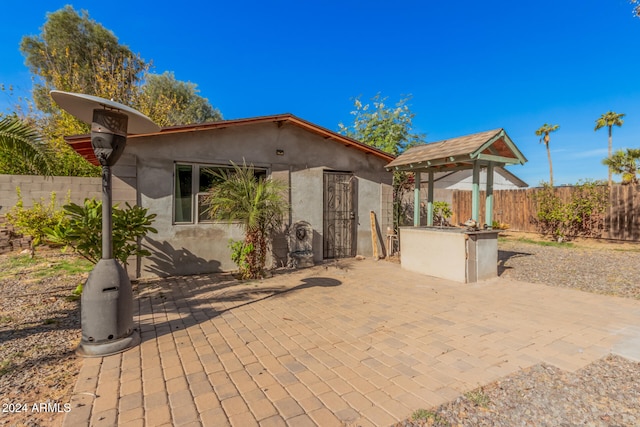 back of house featuring a patio