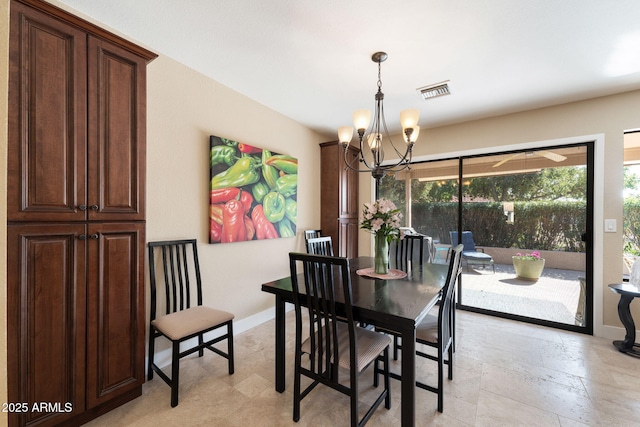 dining room featuring a chandelier