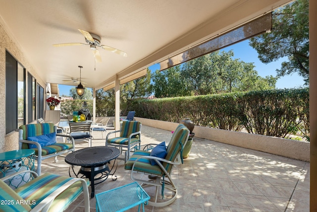 view of patio / terrace featuring ceiling fan