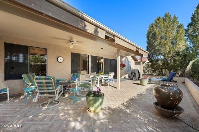 view of patio featuring ceiling fan