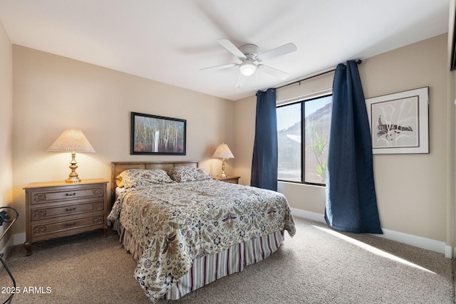 bedroom featuring ceiling fan and carpet