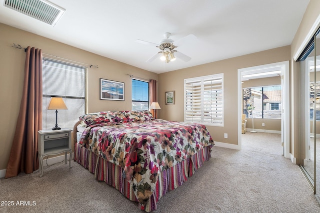 carpeted bedroom featuring ceiling fan