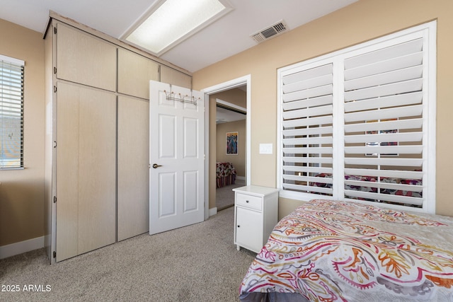 carpeted bedroom with a closet