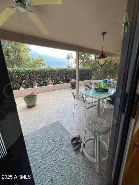 view of patio with ceiling fan