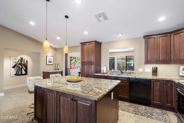 kitchen with a kitchen island, decorative light fixtures, sink, black dishwasher, and a breakfast bar area