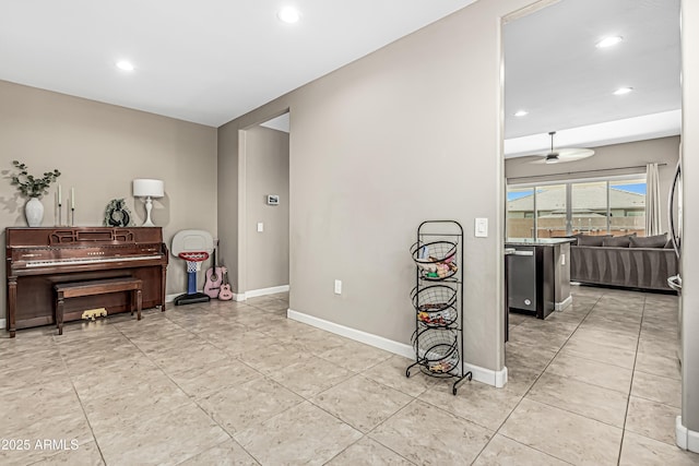 interior space with light tile patterned floors, baseboards, and recessed lighting