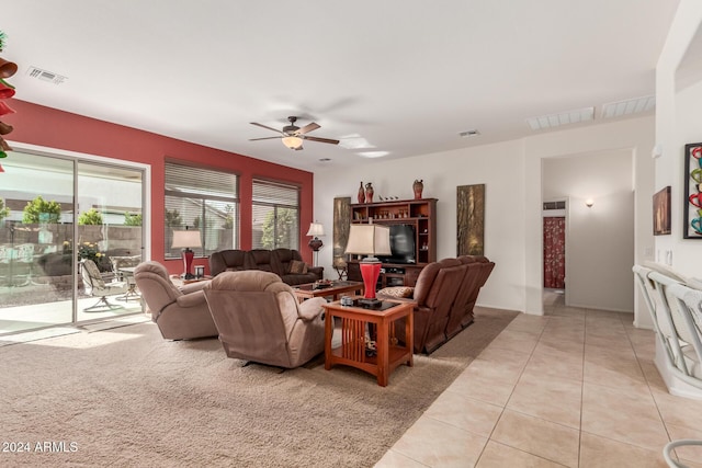 tiled living room featuring ceiling fan